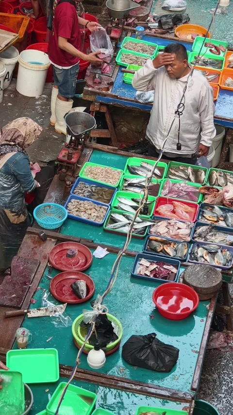 Fresh Seafood and Local Commerce at the Busy Pasar Minggu Traditional Market Stock Footage 340016925