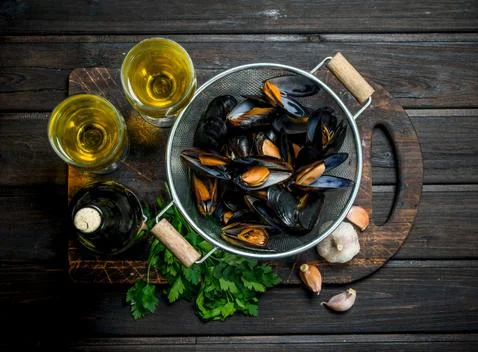 Fresh seafood clams with white wine. Stock Photos