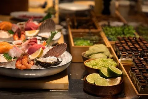 Fresh seafood platter with assorted shellfish and garnishes on display Stock Photos