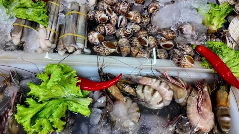 Fresh Seafood Selection on Ice at Thai Night Market Stall Stock Footage 336264427