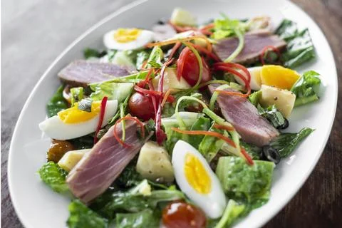 Fresh seared raw tuna mixed vegetable salad with mustard sauce Stock Photos