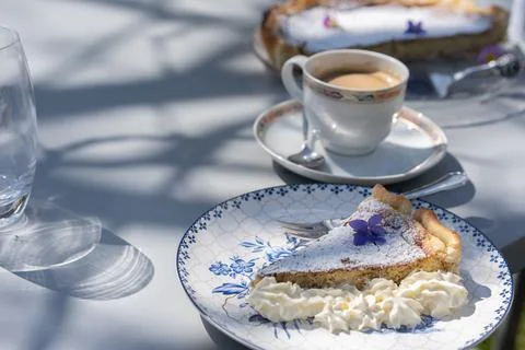 Fresh self made easter pie with flower decoration and coffee outdoor. Stock Photos
