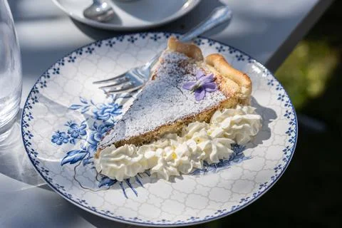 Fresh self made easter pie with flower decoration and coffee outdoor. Stock Photos