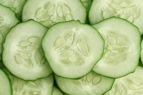 Fresh slice cucumber close-up background. Stock Photos