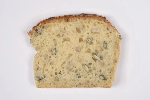 Fresh slice of yeast bread with pumpkin seeds Stock Photos