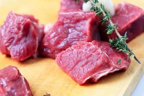 Fresh sliced beef steak with thyme garnish Stock Photos