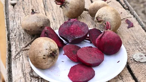 Fresh sliced beetroot on wooden surface. fresh beetroot on wooden background Stock Footage 333030772