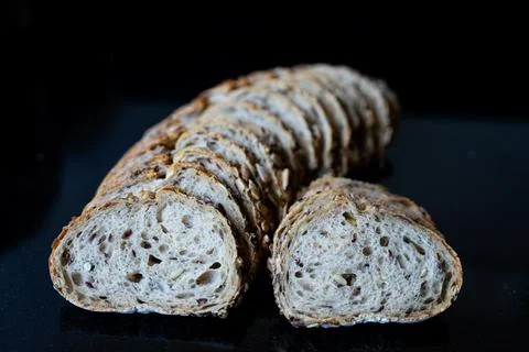 Fresh Sliced Bread on Black Background 写真素材