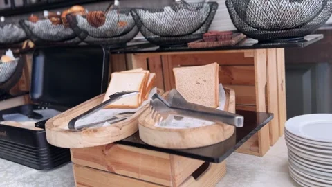 Fresh sliced bread on rustic breakfast buffet Stock Footage 336763613
