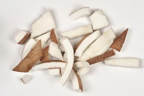 Fresh Sliced Coconut Chunks on White Background Stock Photos