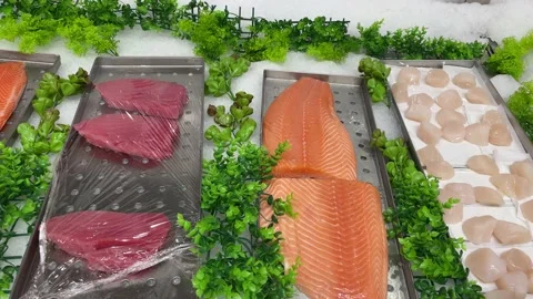 Fresh sliced fish with ice in a super market Stock Footage 233856101