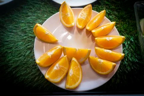 Fresh sliced fruit on a buffet table. Asian buffet restaurant. Stock Photos