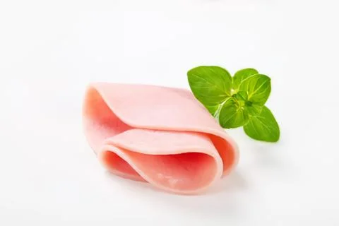Fresh sliced ham with mint leaf Stock Photos