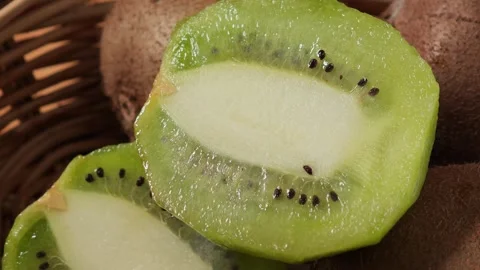 Fresh sliced ​​kiwi in a basket. Stock Footage 334918025