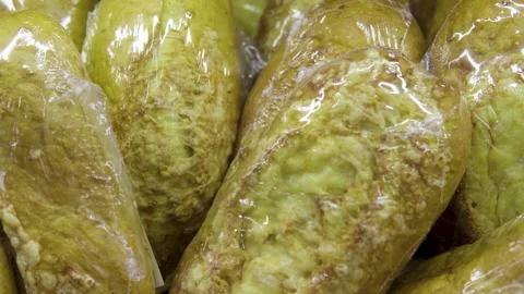 Fresh Sliced Loaves Packed in Clear Plastic Bags on Bakery Display Shelf Stock Footage 330111033