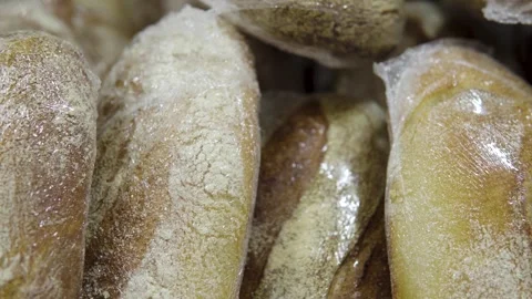 Fresh Sliced Loaves Packed in Clear Plastic Bags on Bakery Display Shelf Stock Footage 330111076
