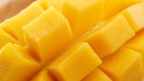 Fresh Sliced Mango Squared rotation in 4k slow motion Stock-Footage 128641771