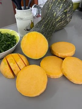Fresh sliced pumpkin in the kitchen Fotos de archivo