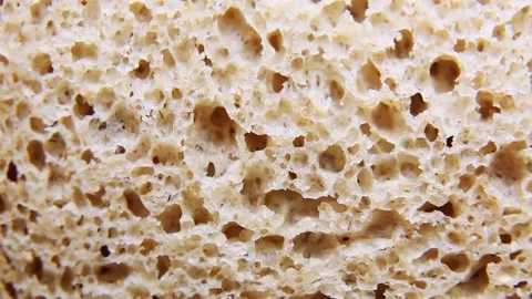 Fresh sliced rye flour bread rotates. Black bread for toast and sandwiches. Stock Footage 191811289