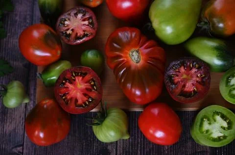 Fresh sliced tomatoes on black background, copy space Stock Photos