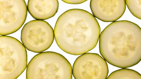 Fresh sliced zucchini (squash) rotating on white in 4K. 스톡 동영상 87111992