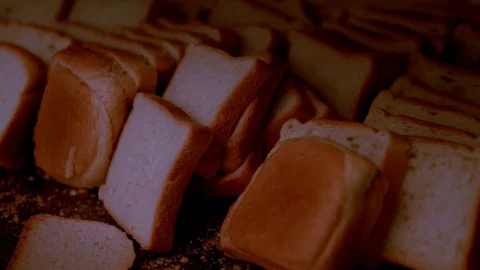Fresh slices of white bread stacked on a tray Stock Footage 108113717