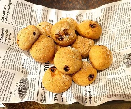 Fresh small round bread on the paper for eating in the restaurant Stock Photos