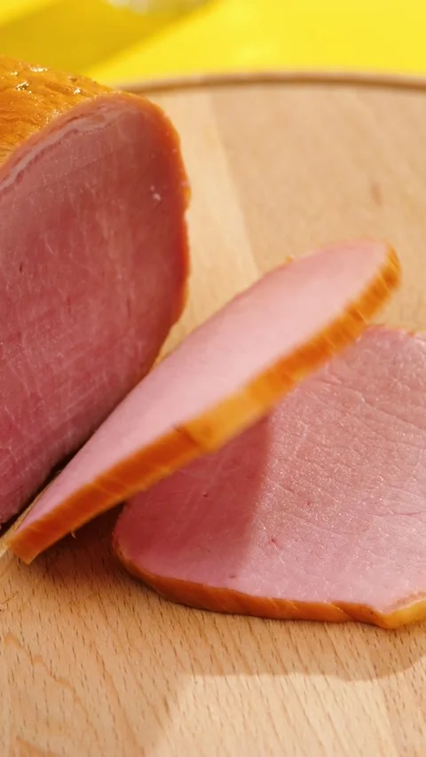 Fresh Smoked Ham Slice Falling on Wooden Board Slow Motion Vertical Stock Footage 292562467