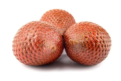 Fresh snake fruit is isolated on a white background.Red Salacca. Salak frui.. Stock Photos