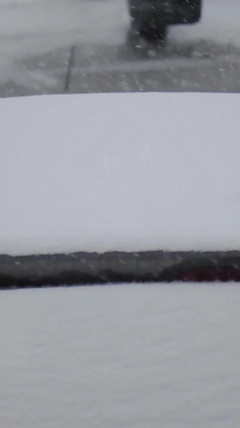Fresh snow gradually blankets outdoor ledge during cold winter snowfall, with Stock Footage 346774424