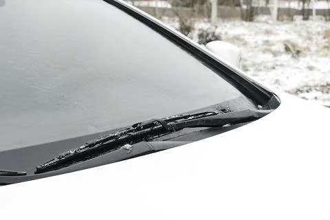 Fresh Snow layer on windscreen, windshield, window of car. automobile in bliz Stock Photos