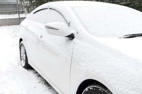 Fresh Snow layer on windscreen,windshield,window of car. automobile in bliz.. Stock Photos
