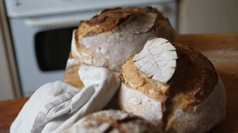 Fresh sourdough bread on kitchen fly over loaves Stock Footage 196000194