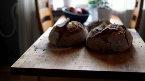 Fresh sourdough bread on kitchen table Stock Footage 195982105