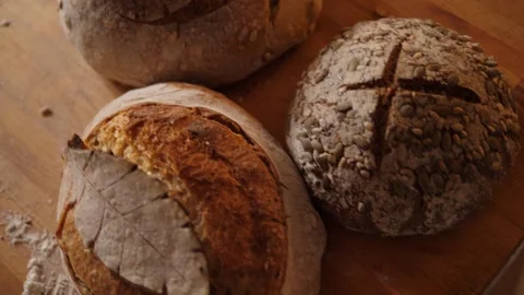 Fresh sourdough bread on kitchen table Stock Footage 196000009