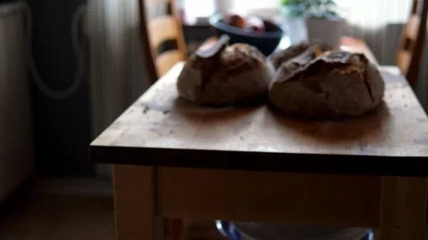 Fresh sourdough bread on kitchen table Stock Footage 196000058