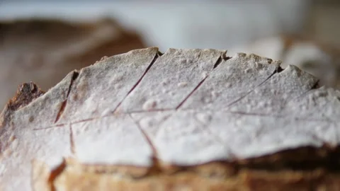 Fresh sourdough bread on kitchen table fly over loaves Stock Footage 196000109