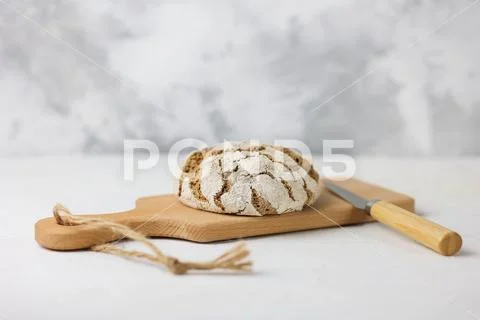 Fresh sourdough bread on a light background. Freshly baked homemade rye ...
