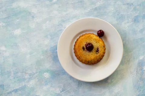 Fresh sponge cake with cherries on rustic wooden background Stock Photos