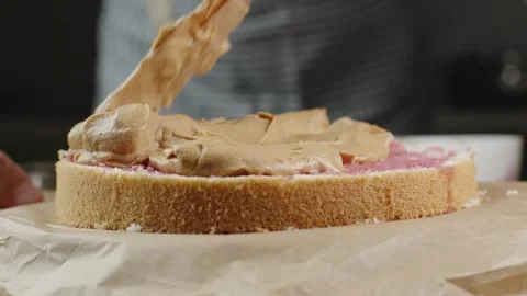 A fresh sponge cake for making a cake with creamy caramel cream Stock Footage 286302974