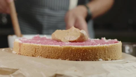 A fresh sponge cake for making a cake with creamy caramel cream Stock Footage 286302979