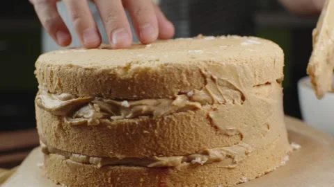 A fresh sponge cake for making a cake with creamy caramel cream Stock Footage 286305772