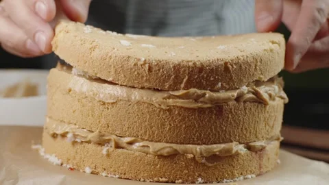 A fresh sponge cake for making a cake with creamy caramel cream Stock Footage 286305831