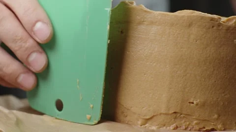 A fresh sponge cake for making a cake with creamy caramel cream Stock Footage 286305889