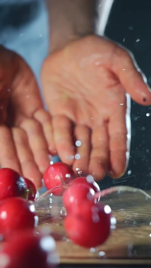 Fresh spring radish in male hands, vertical video. preparing healthy salad at Stock Footage 274733441