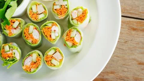 Fresh spring rolls with assorted vegetables with spicy sauce. Stock Photos