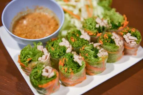 Fresh spring rolls with vegetable and pork homemade with peanut sauce - Thai  Stock Photos