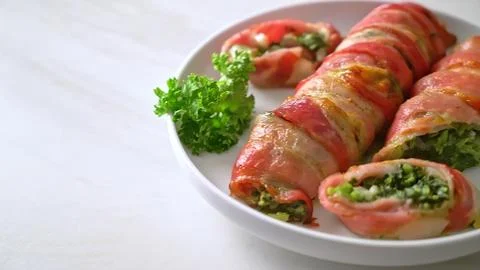 Fresh spring rolls with vegetables and herbs on a white plate Stock Photos