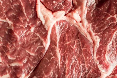 Fresh steak on marble background. Uncooked beefsteak cooking on a kitchen 스톡 사진