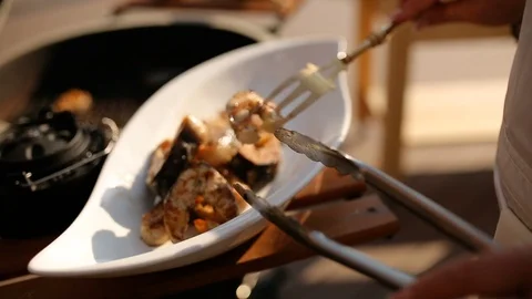 Fresh steaks from fish cooked on a grill, close-up on a white plate. Video stock 91270092